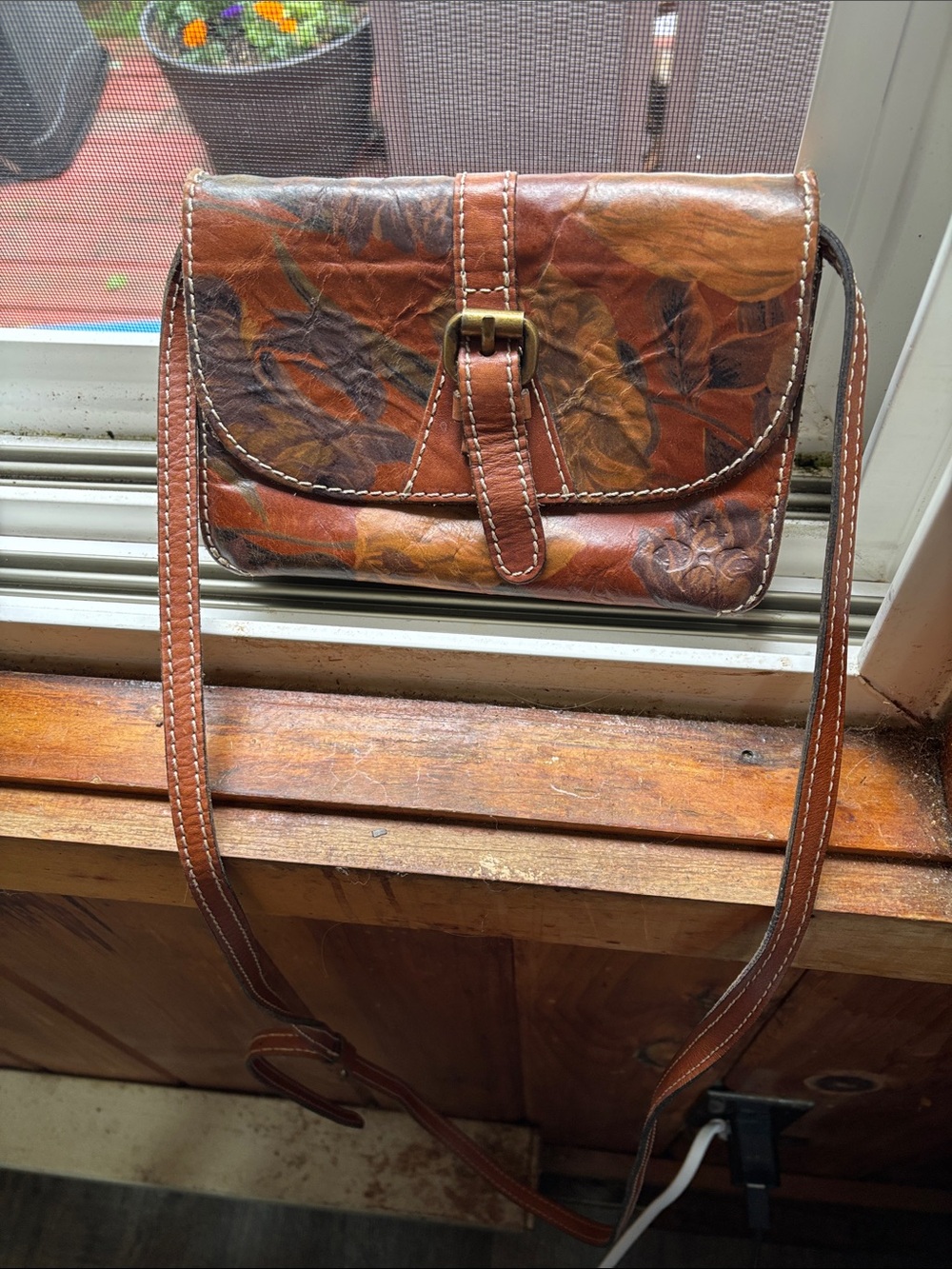 Leather Floral Embossed Crossbody Bag in Brown